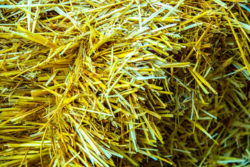 Hay background. Haystacks background, texture. Wheat gold hay in field. Hay prepared for farm animal feed in winter. Stacks dry hay open air fiel. Straw bale harvesting.