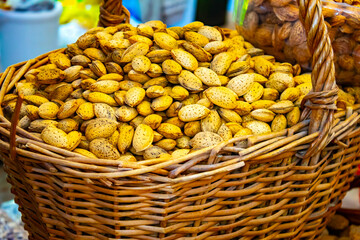 Fresh almonds nut on a wooden table in the summer garden