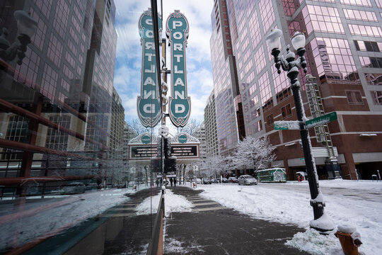 Portland, OR, USA - Feb 23, 2023: The iconic Portland sign at the Arlene Schnitzer Concert Hall, a historic theater building on Broadway in downtown Portland, Oregon, after snowfall in winter.