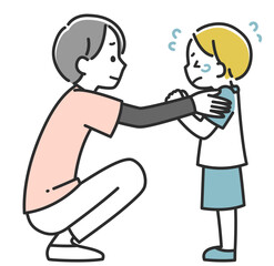 なぐさめる女性医療スタッフと泣いている男の子