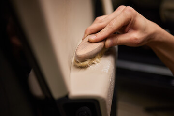Dry cleaning of white leather interior. Dirty car interior. cleaning the white leather seat of the...