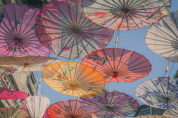 Naklejka premium Vibrant colorful Chinese style umbrellas at the umbrella street in Hohhot, China