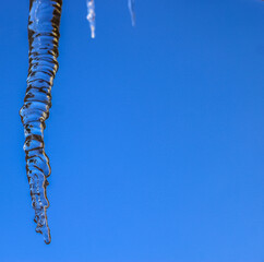 Icicle with blue sky as background
