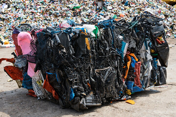 Pack of plastic materials in recycling plant yard closeup