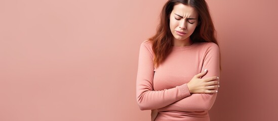 Woman experiencing stomach pain - obrazy, fototapety, plakaty