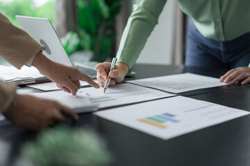 Alternative energy environment businesspeople checking document and brainstorm about future power