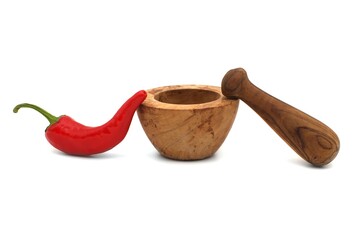 Red chili pepper and wooden pestle with mortar