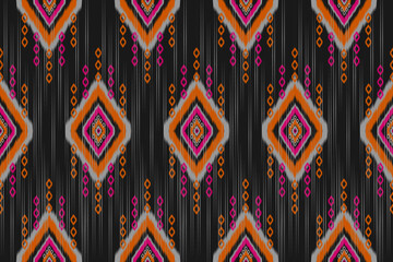 Fototapeta premium Fabric ethnic pattern art. Ikat seamless pattern in tribal. American, Mexican style. Design for background, wallpaper, illustration, fabric, clothing, carpet, textile, batik, embroidery.