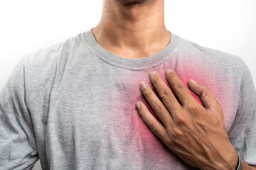 Young man having heart ache, holding hand on chest. Heart attack or stroke. risk of coronary heart...