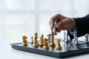 Businessman's hands move chess figures and checkmate opponent during match. Strategy, management,...