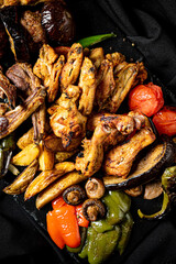 grilled meat on the black background