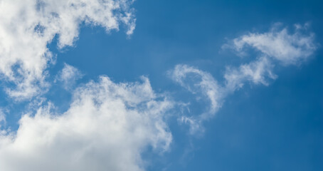 Background of blue sky with white clouds