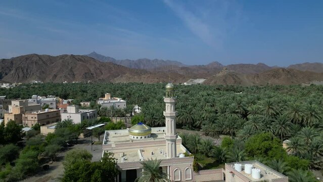 A mosque in the middle of a small village in Oman