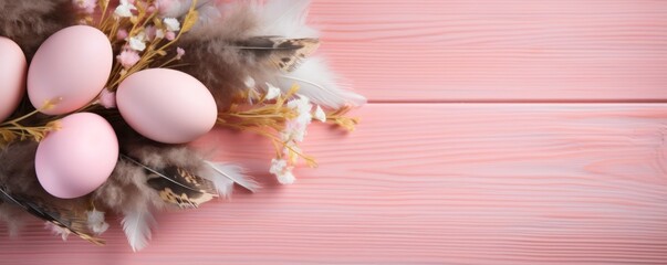 Banner. Easter eggs, feathers in a nest on a peach fuzz color wooden background. The minimal concept. Top view. Card with a copy of the place for the text.