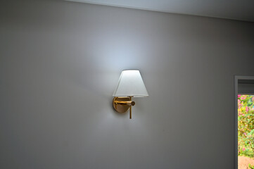 Cute interior design with shade lamps installed on the wall
