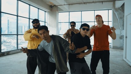 Multicultural dancer practice street dance and move to hip-hop music. Professional hipster group...