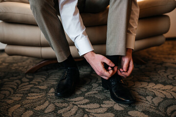 A man ties his shoelaces