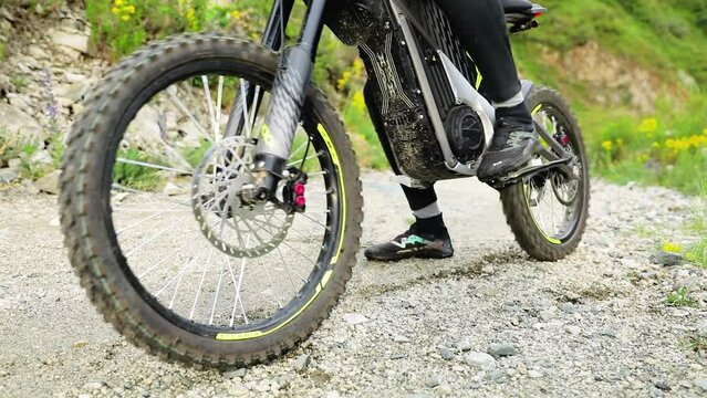 Mountain biker riding on trail in green forest