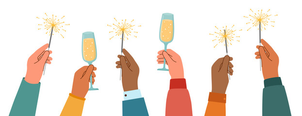Human hands with sparklers and champagne flutes raised upwards. Celebration concept.  © Julia Anisimova
