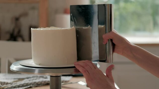 Woman is cooking homemade cake. Pastry chef collects cake from biscuit layers, cake preparation. cooking, baking and cooking, home cooking