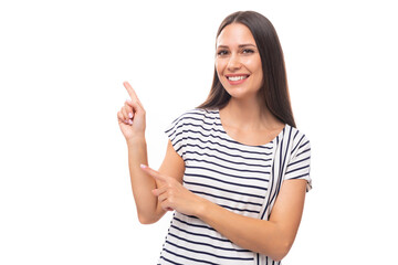 young pretty european brunette woman in a striped sweater gesturing actively on a white background with copy space