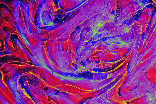 Abstract holographic neon red, orange, purple, blue cosmetic gel serum background texture. Jelly pattern, transparent slime liquid art gel galaxy substance. Cosmic surreal psychedelic backdrop