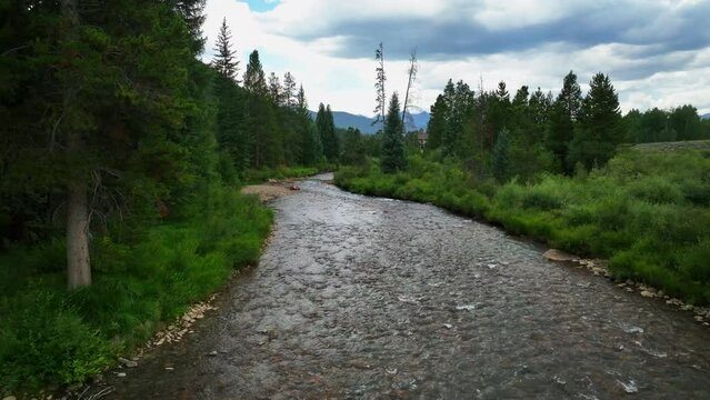 Keystone River Blue Fishing Golfing Peaceful Ski Resort Aerial Cinematic Drone Summer Breckenridge Colorado Vail Resort Epic Pass Ski Snowboard Bridge Path Slowly Forward Motion