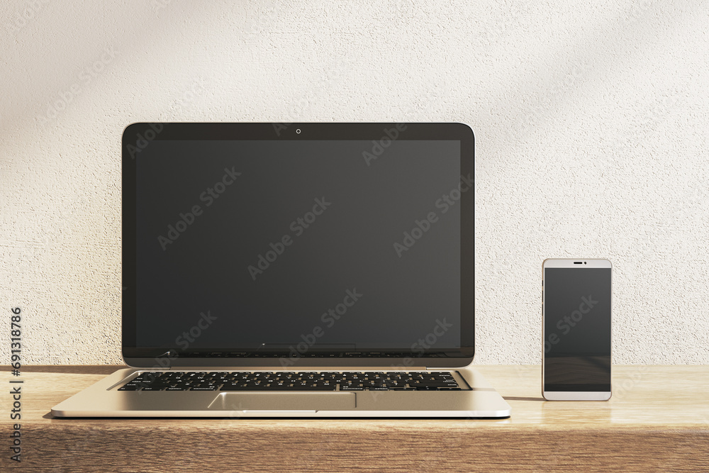 Poster close up of empty laptop and smartphone on wooden desk. concrete wall background. device presentatio