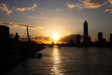 Sunset in the city from Willemsbrug bridge in Rotterdam, Netherlands.