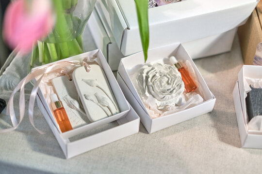 The aromatherapy stone, designed to naturally diffuse scents, alongside a fragrance bottle, symbolizes the growing preference for natural home fragrance solutions that blend seamlessly into home decor