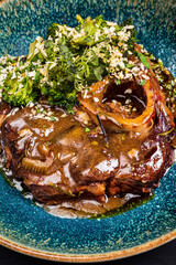 ossobuco with sauce and broccoli
