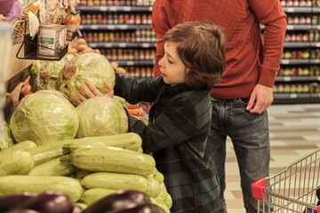 An adult stands by, ensuring safety and offering subtle guidance, emphasizing the role of family in...