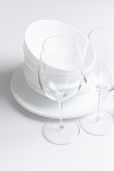 Set of clean dishware, cutlery on white background
