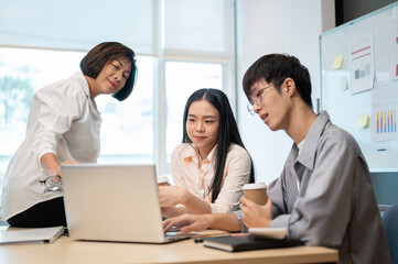 Group of Asian business people are in the meeting, talking and brainstorming on a new project.