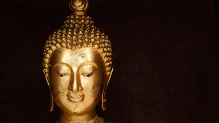 Buddha's face on blur background, Believe in Buddhism, Buddha statue used as amulets of Buddhism...