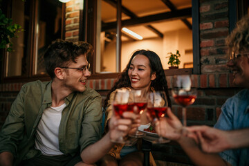 iverse friends enjoying a backyard pasta feast – laughter, pasta, and good times