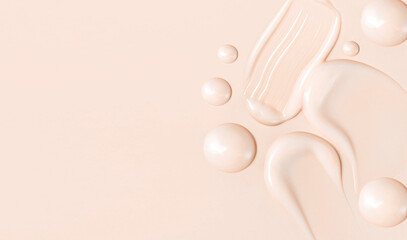 composition of smears of cream texture on a beige background