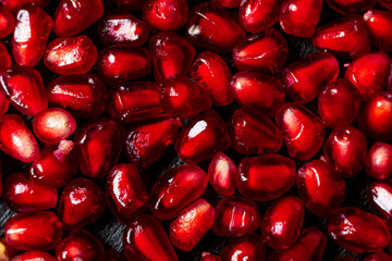 pomegranate seeds on the dark background
