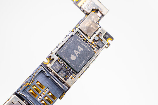 Kyiv, Ukraine - August 25, 2023: Apple iPhone 4 motherboard with A4 processor, close-up on a white background