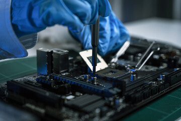 Macro photo of a finger touching a laptop chip close up, computer hardware and technology concept.