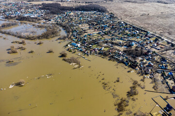 Aerial view of village areas with houses flooded during a rural spring river flood