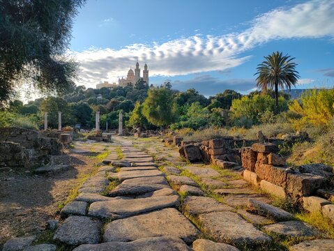 Panoramic view of the Roman archaeological site of Hippo, and the basilica of Saint-Augustin at the top of the hill in the background in Annaba
