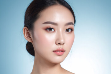 Obraz premium Close up potrait of an beautiful korean woman natural healthy cosmetic with clean perfect skin on blue background, skin care, facial treatment, beauty and spa, Asian women potrait.