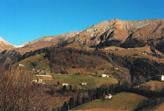 Scenic Mountain Village View During a Sunny Winter Autumn Day in the Italian Alps. Zambla Alta, Bergamo Province, Italy. Film Photography