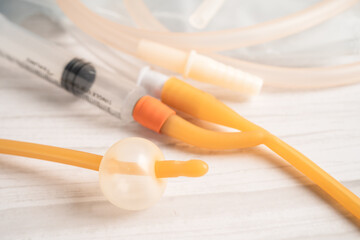 Foley urinary catheter with urine bag for disability or patient in hospital.