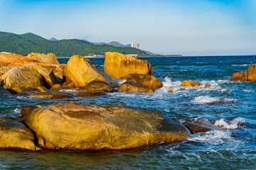Rocky seashore.

A sea wave is beating against the rocks near the seashore. Filmed at sunset near...