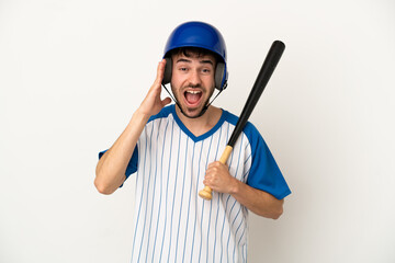 Young caucasian man playing baseball isolated on white background with surprise and shocked facial expression