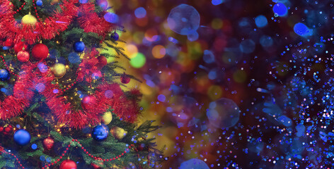 Christmas tree decorated with blue, red and golden festive balls against blurred background, bokeh...