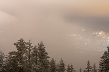 Fototapeta premium Mystical Haze: Drammen Enveloped in Smoke After New Year's Night Fireworks Extravaganza.