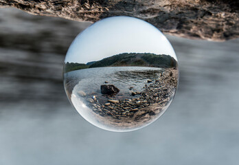 Lens ball at lake near the Cape Breton Island Coast line cliff scenic Cabot Trail route, Nova...